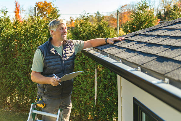 Professional Storm Damage Roof Repair technician working in Bernard, IA